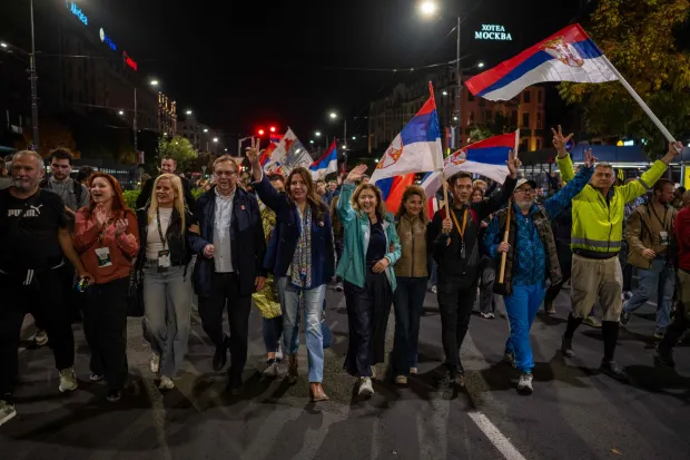 MP candidates from the Students? List -- an electoral list backed by the student-led protest movement -- welcome students who had marched to Belgrade and join them in a procession on the eve of the final pre-election rally in central Belgrade on October 21, 2026. The student-led movement emerged from nationwide protests following the November 2024 collapse of a railway station canopy in Novi Sad that killed 16 people, with demands expanding to include early elections in May 2025. The student movement formally entered the electoral race in September, challenging the Serbian Progressive Party (SNS). (Photo by Andrej ISAKOVIC/AFP)