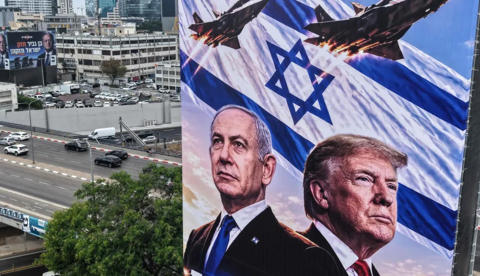 An aerial view shows a campaign billboard depicting Prime Minister Benjamin Netanyahu of the Likud party and US President Donald Trump in Tel Aviv on October 26, 2026, on the eve of the Israel's legislative elections. (Photo by JACK GUEZ/AFP)