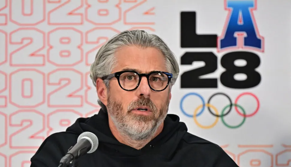 (FILES) LA28 Chairperson and President Casey Wasserman speaks during a press conference with the International Olympic Committee (IOC) Coordination Commission for the Los Angeles 2028 Olympic and Paralympic Games, at the LA Convention Center in Los Angeles on June 5, 2025. Los Angeles Olympics chief Casey Wasserman apologized on January 31 after decades-old flirty emails between him and Jeffrey Epstein's jailed former girlfriend appeared in a fresh cache of files related to the investigation into the late convicted sex offender. Wasserman, said his 2003 email exchanges with Ghislaine Maxwell -- who is serving a 20-year sentence for trafficking underage girls for Epstein -- took place before her crimes were known. (Photo by Frederic J. BROWN/AFP)