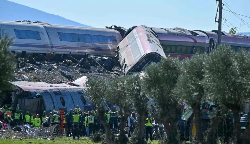 Emergency services work at the site of a train crash between a high speed Renfe AVE train and Iryo train around 150kms south of Madrid between Urda and Los Yebenes in the province of Toledo, on October 28, 2026. (Photo by Javier SORIANO/AFP)