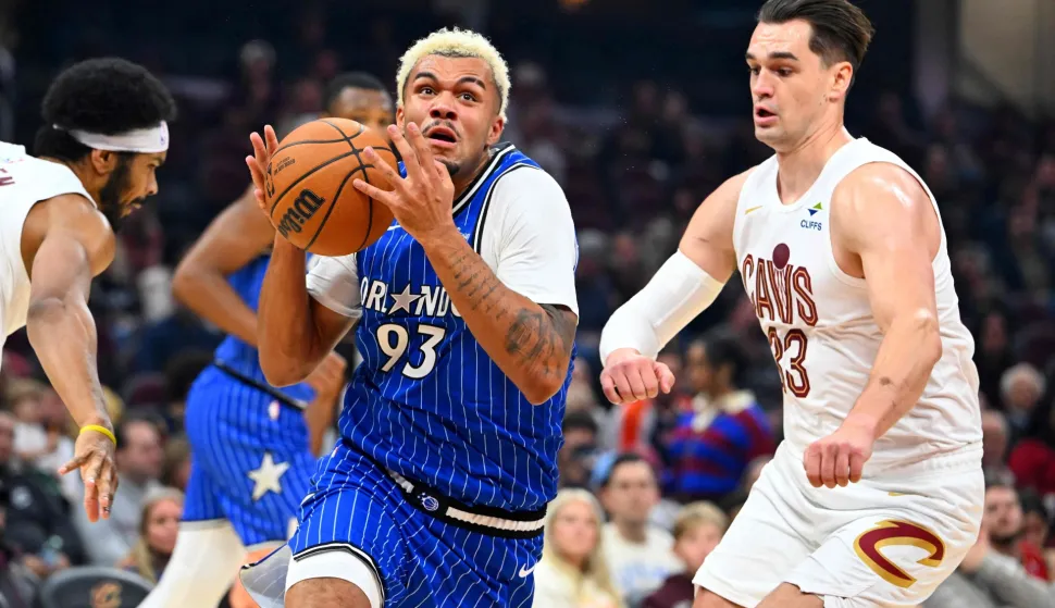CLEVELAND, OHIO - OCTOBER 11: Noah Penda #93 of the Orlando Magic drives to the basket around Mario Hezonja #33 of the Cleveland Cavaliers during the first half of a preseason game at Rocket Arena on October 11, 2026 in Cleveland, Ohio. NOTE TO USER: User expressly acknowledges and agrees that, by downloading and or using this photograph, User is consenting to the terms and conditions of the Getty Images License Agreement. Jason Miller/Getty Images/AFP (Photo by Jason Miller/GETTY IMAGES NORTH AMERICA/Getty Images via AFP)
