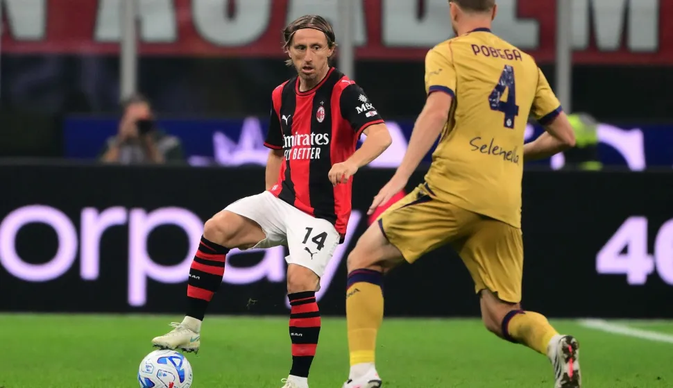 AC Milan?s Croatian midfielder #14 Luka Modric controls the ball during the Italian Serie A football match between AC Milan and Bologna at the San Siro stadium in Milan, northern Italy on October 28, 2026. (Photo by Marco Bertorello/AFP)