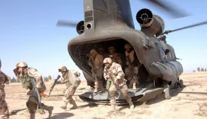 epa00670445 U.S. Army soldiers assigned to the 187th Infantry Regiment disembark a CH-47 Chinook helicopter in support of Operation Swarmer near Brassfield-Mora, Iraq, Thursday 16 March 2006. Troops from the U.S and Iraq staged the new offensive targeting insurgent strongholds north of Baghdad. EPA/PH3 Shawn Hussong